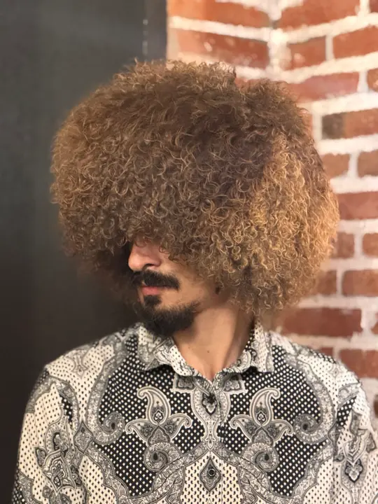 Goat Fur Papakha Special, three-quarter view: dense, springy golden brown curls all around the crown