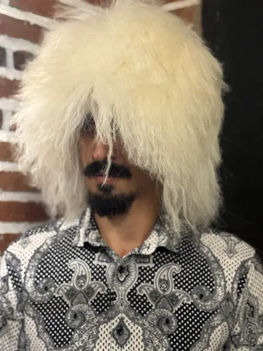Very White Sheepskin Papakha, front view: thick straight white wool with a few strands crossing the face