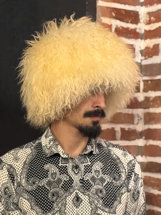 White Sheepskin Papakha Special in profile: the wide, rounded crown of creamy curly wool